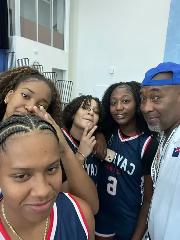Cayman girls basketball players with their coach