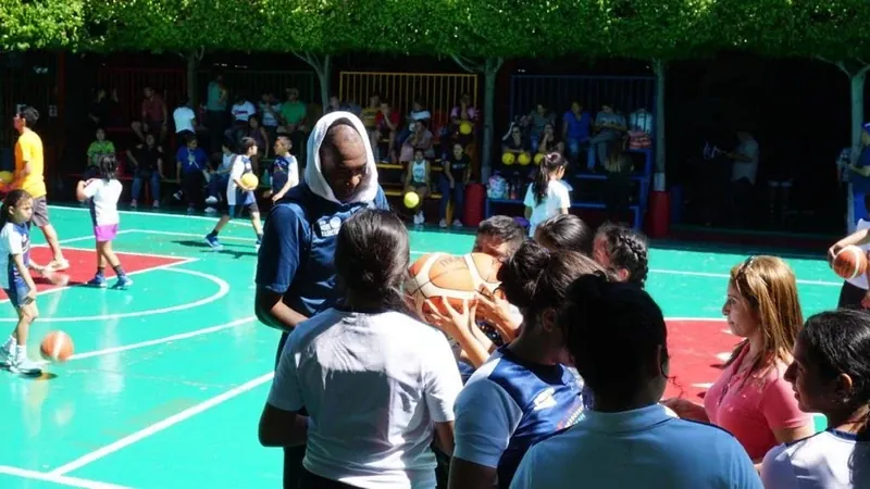 Youth basketball clinic on an outdoor court | Cory McGee